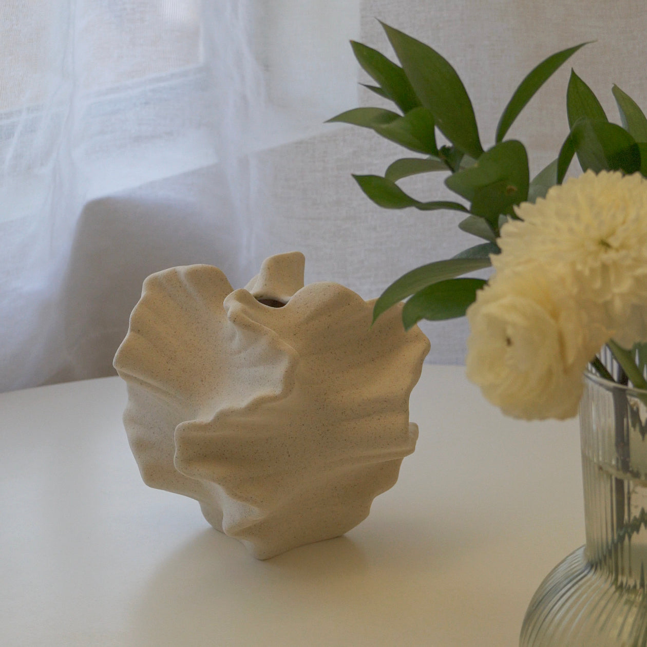 coral ceramic vase on the table