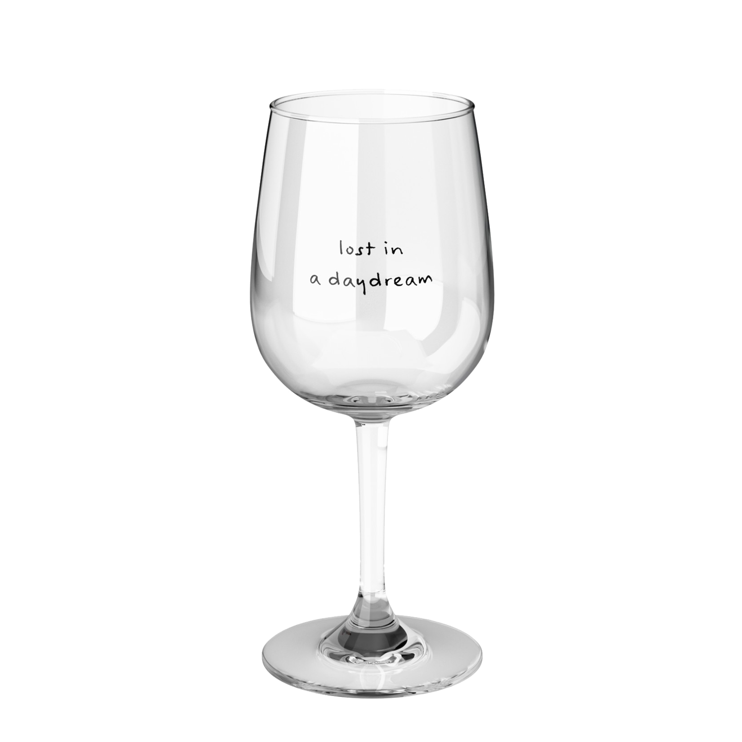 a clear wine glass printed with lost in a daydream in black