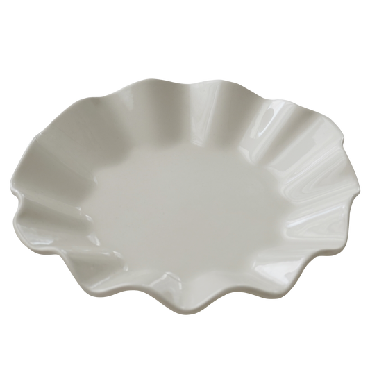 white plate with a ruffle edge